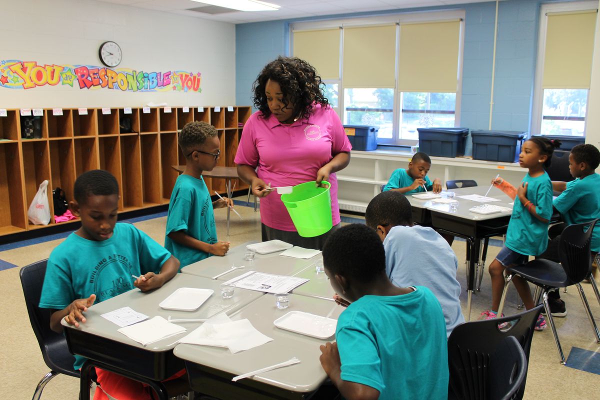 A teacher leads an activity  at the 100 Black Men of Indianapolis' Summer Academy at IPS School #74.