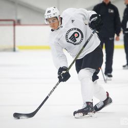 Jack St. Ivany (D) hits a puck during a practice drill at Flyers development camp