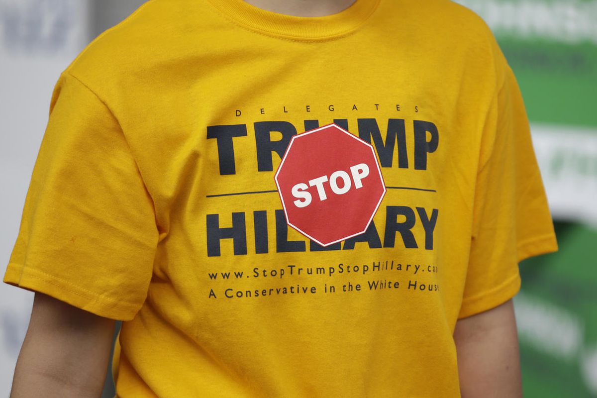 In this April 23, 2016, photo, a person displays their t-shirt outside of the Utah Republican Party 2016 convention, in Salt Lake City.