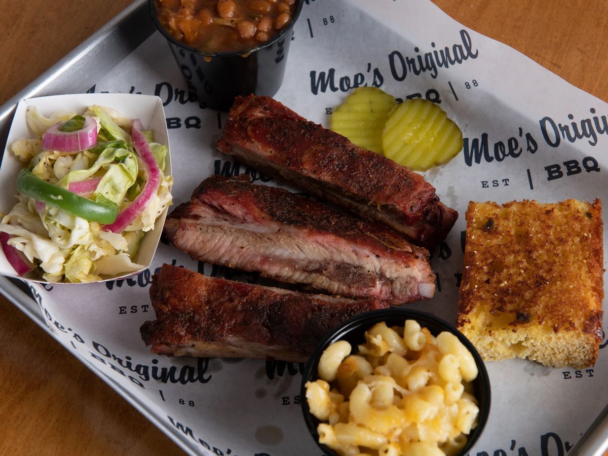 A plate of barbecue ribs, mac and cheese, cornbread, and salad, from Moe’s Original BBQ in Tahoe City