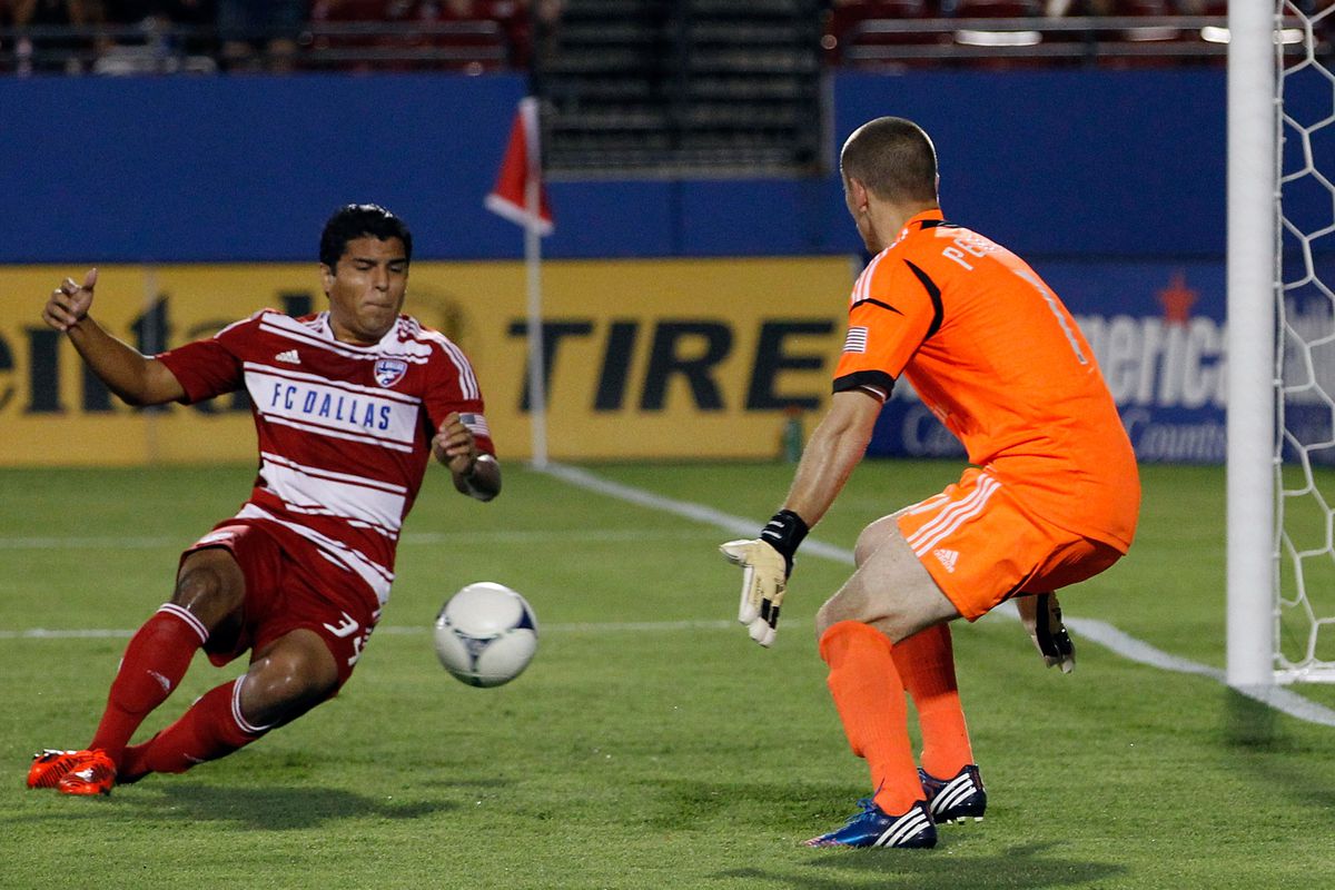 FRISCO, TX - JULY 21:  Ruben Luna #34 of the FC Dallas scores against Troy Perkins #1 of the Portland Timbers at FC Dallas Stadium on July 21, 2012 in Frisco, Texas. FC Dallas beat the Portland Timbers 5-0. (Photo by Tom Pennington/Getty Images)