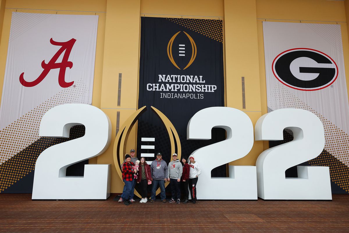 Fans pose for pictures at Playoff Fan Central in the Indiana Convention Center ahead of the 2022 CFP National Championship between the Alabama Crimson Tide and the Georgia Bulldogs at Lucas Oil Stadium on January 09, 2022 in Indianapolis, Indiana.