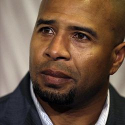 Former NFL player Dorsey Levens listens to Mary Ann Easterling, the widow of former NFL player Ray Easterling, during a news conference Tuesday, April 9, 2013, in Philadelphia after a hearing to determine whether the NFL faces years of litigation over concussion-related brain injuries. Thousands of former players have accused league officials of concealing what they knew about the risk of playing after a concussion. The lawsuits allege the league glorified violence as the game became a $9 billion-a-year industry. 