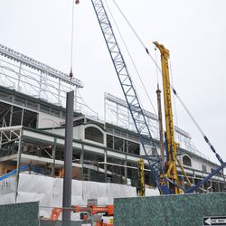 Steel beam being lowered in the triangle lot