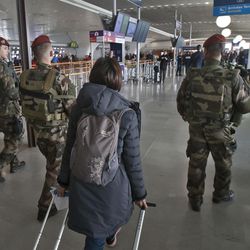 French soldiers patrol at Charles de Gaulle airport, in Roissy, north of Paris, Tuesday, March 22, 2016. Authorities are tightening security at airports and on the streets of European cities after attacks on the Brussels airport and subways system that killed at least one person and injured many others. Security has been beefed up in France, Austria, Poland and the Czech Republic. 