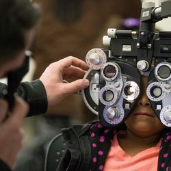Dr. Jefferson Langford gives an eye exam to Layla Lee, 5, during SightFest at the Jordan School District Auxiliary Services building in West Jordan on Thursday, Dec. 8, 2016. SightFest is a partnership between Friends for Sight and the Utah Optometric Association that on Thursday provided free eye exams and glasses for 125 students from Title I schools in the Jordan School District.