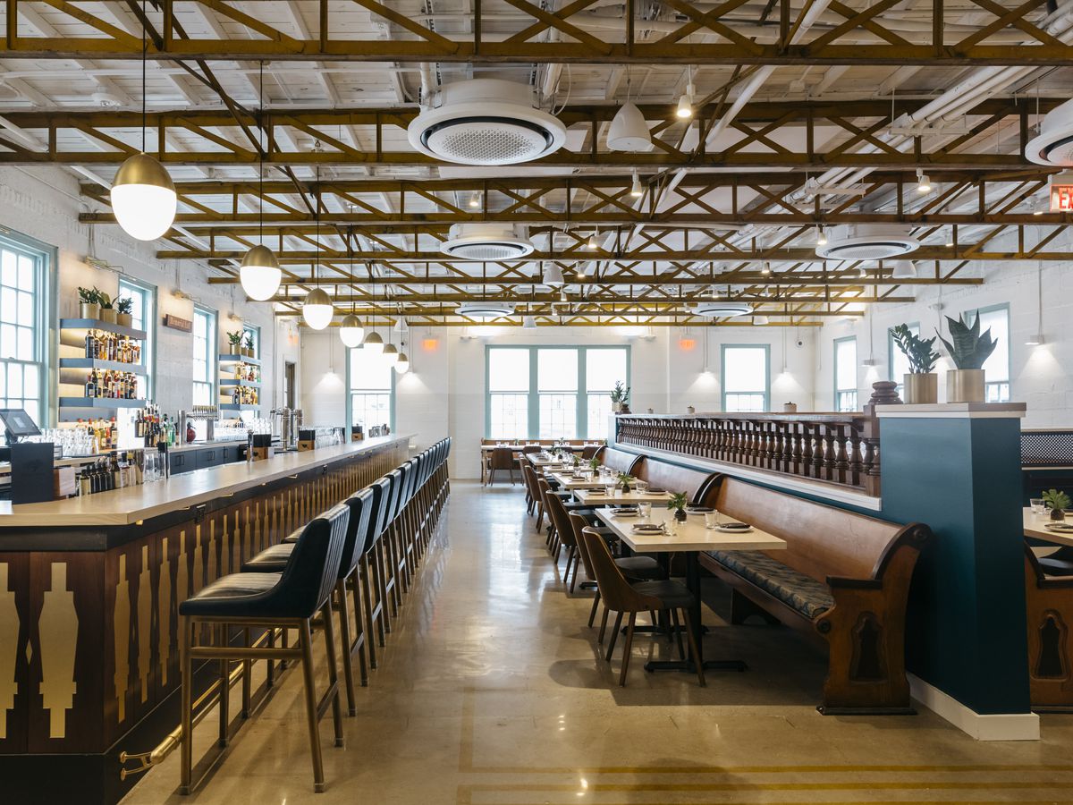 The interior of Hathorne with bar seating and low-top tables