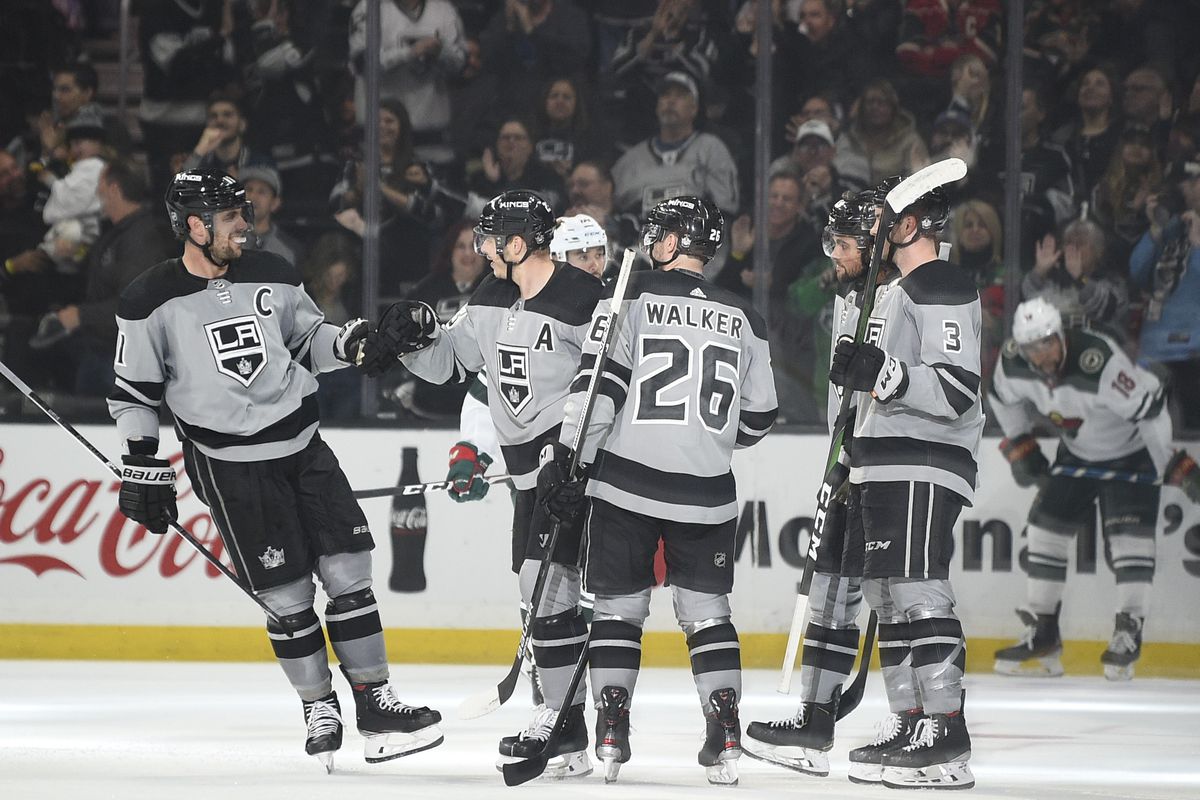 Mar 7, 2020; Los Angeles, California, USA; Los Angeles Kings center Anze Kopitar (11) celebrates a goal by right wing Dustin Brown (23) during the third period against the Minnesota Wild at Staples Center.