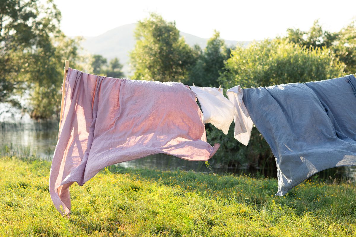 Freshly cleaned sheets hanging outside to dry.