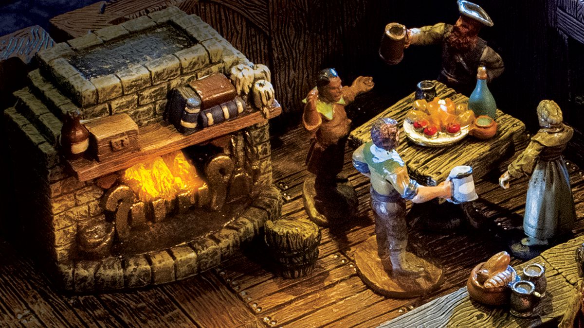 four patrons in a medieval tavern share a story around a table near a roaring fire — all in miniature, with modular components from Dwarven Forge.