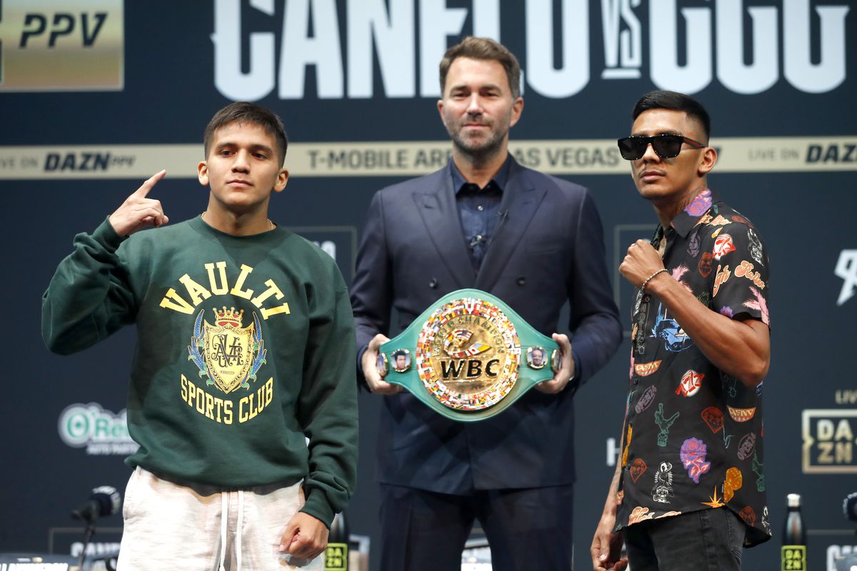 WBC super flyweight champion Jesse Rodriguez (L) poses with Israel Gonzalez during a news conference at the KA Theatre at MGM Grand Hotel &amp; Casino on September 15, 2022 in Las Vegas, Nevada. Boxing promoter Eddie Hearn (C) holds the WBC title belt.