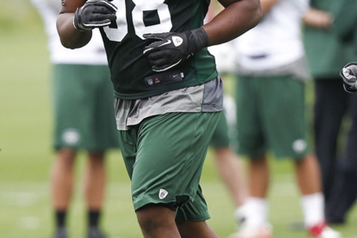 FLORHAM PARK, NJ - MAY 04:  Quinton Coples #98 of the New York Jets works out during the Jets Rookie Minicamp on May 4, 2012 in Florham Park, New Jersey.  (Photo by Jeff Zelevansky/Getty Images)