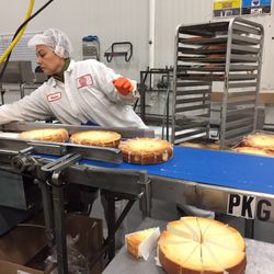 The production line includes slicing then wrapping the cheesecakes. | Sun-Times Staff