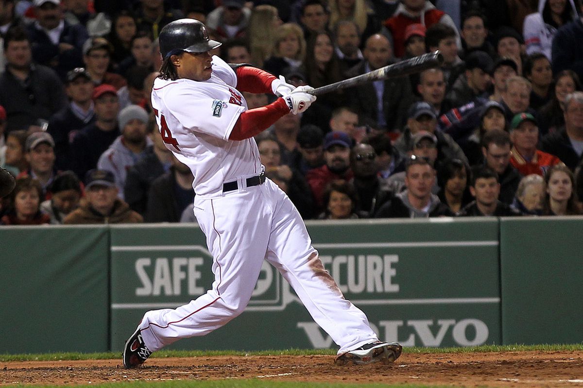 BOSTON, MA:  Darnell McDonald #54 of the Boston Red Sox connects for a home run in the third inning against the Oakland Athletics at Fenway Park in Boston, Massachusetts. (Photo by Jim Rogash/Getty Images)