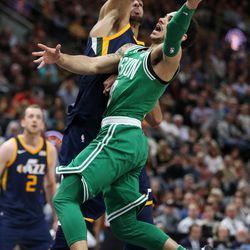 Boston Celtics guard Shane Larkin (8) drives to the hoop against Utah Jazz center Rudy Gobert (27) at Vivint Smart Home Arena in Salt Lake City on Wednesday, March 28, 2018.