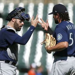 DETROIT, MI - SEPTEMBER 1: Catcher Curt Casali #5 of the Seattle Mariners celebrates with pitcher Penn Murfee #56 after a 7-0 win over the Detroit Tigers at Comerica Park on September 1, 2022, in Detroit, Michigan