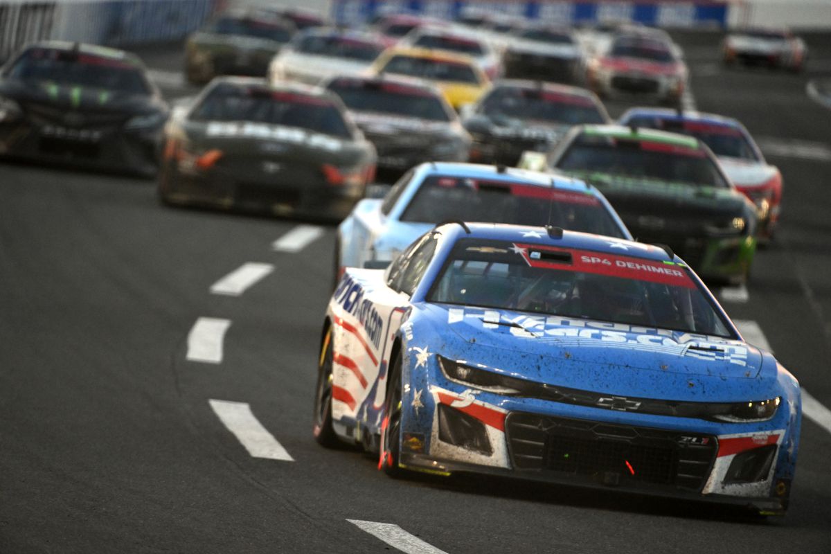 Kyle Larson, driver of the #5 HendrickCars.com Patriotic Chevrolet, leads a pack of cars during the NASCAR Cup Series Coca-Cola 600 at Charlotte Motor Speedway on May 29, 2023 in Concord, North Carolina.