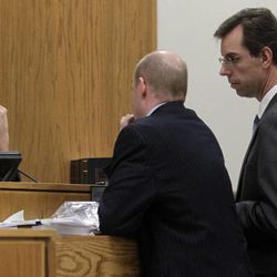 Judge Derek Pullan, left, speaks to prosecutor Chad Grunander and defense lawyer Randy Spencer during a break in testimony of Martin MacNeill's daughter Alexis Somers, right, at MacNeill's murder trial in Provo, Thursday, Oct. 31, 2013.
