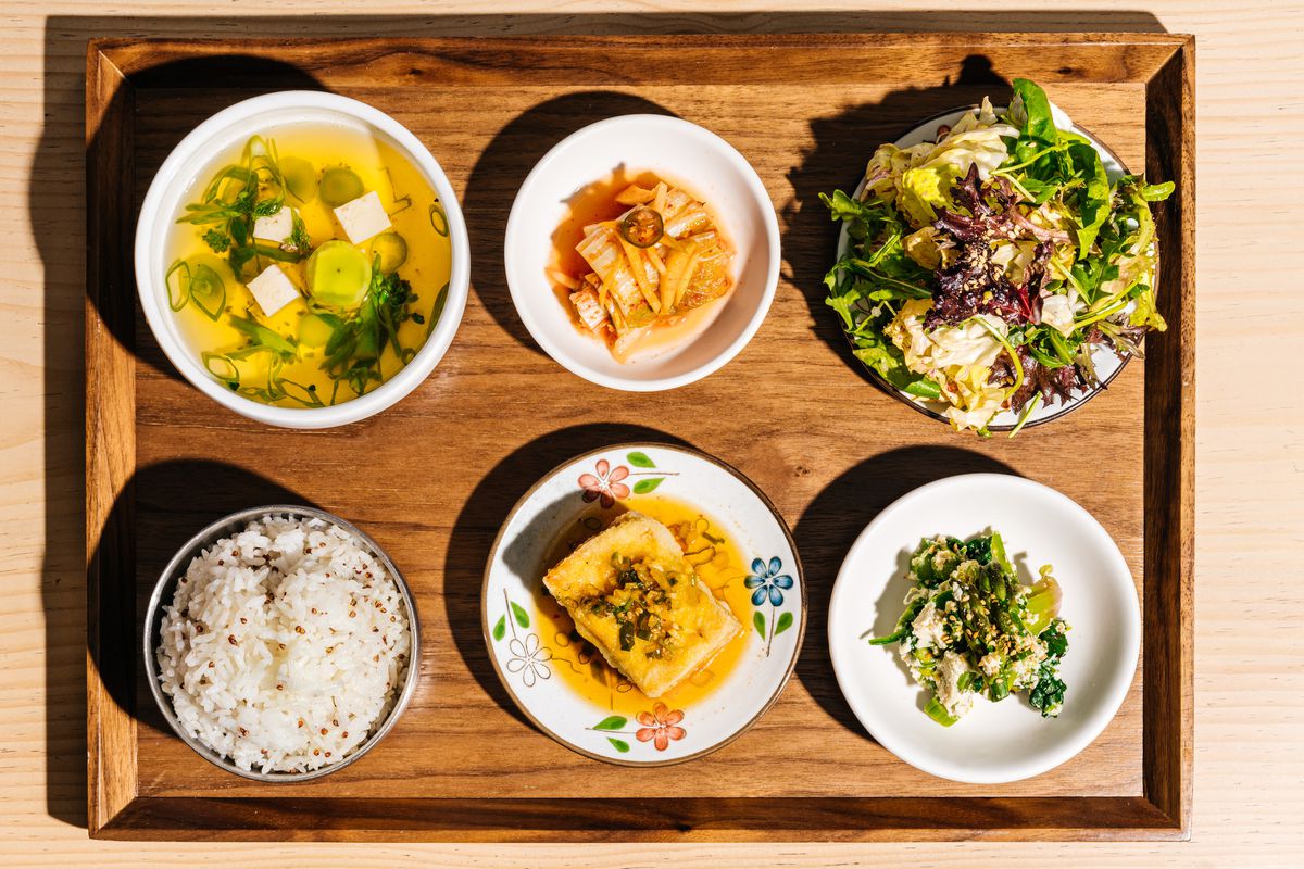 An assortment of banchan in plates from Joodooboo in Oakland, California.