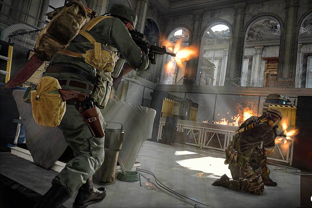 A Call of Duty: Warzone player fires an assault rifle at an enemy