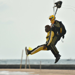 Rhymefest lands after his tandem jump with the U.S. Army Golden Knights. | Colin Boyle/Sun-Times
