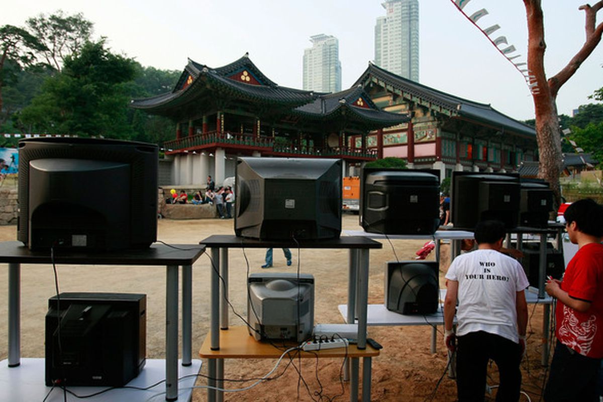 SEOUL, SOUTH KOREA - JUNE 21:  People set up TVs to watch the North Korean (Korea DPR) team in their Group G match against Portugal at the Bongeun Buddhist Temple on June 21, 2010 in Seoul, South Korea.  (Photo by Chung Sung-Jun/Getty Images)