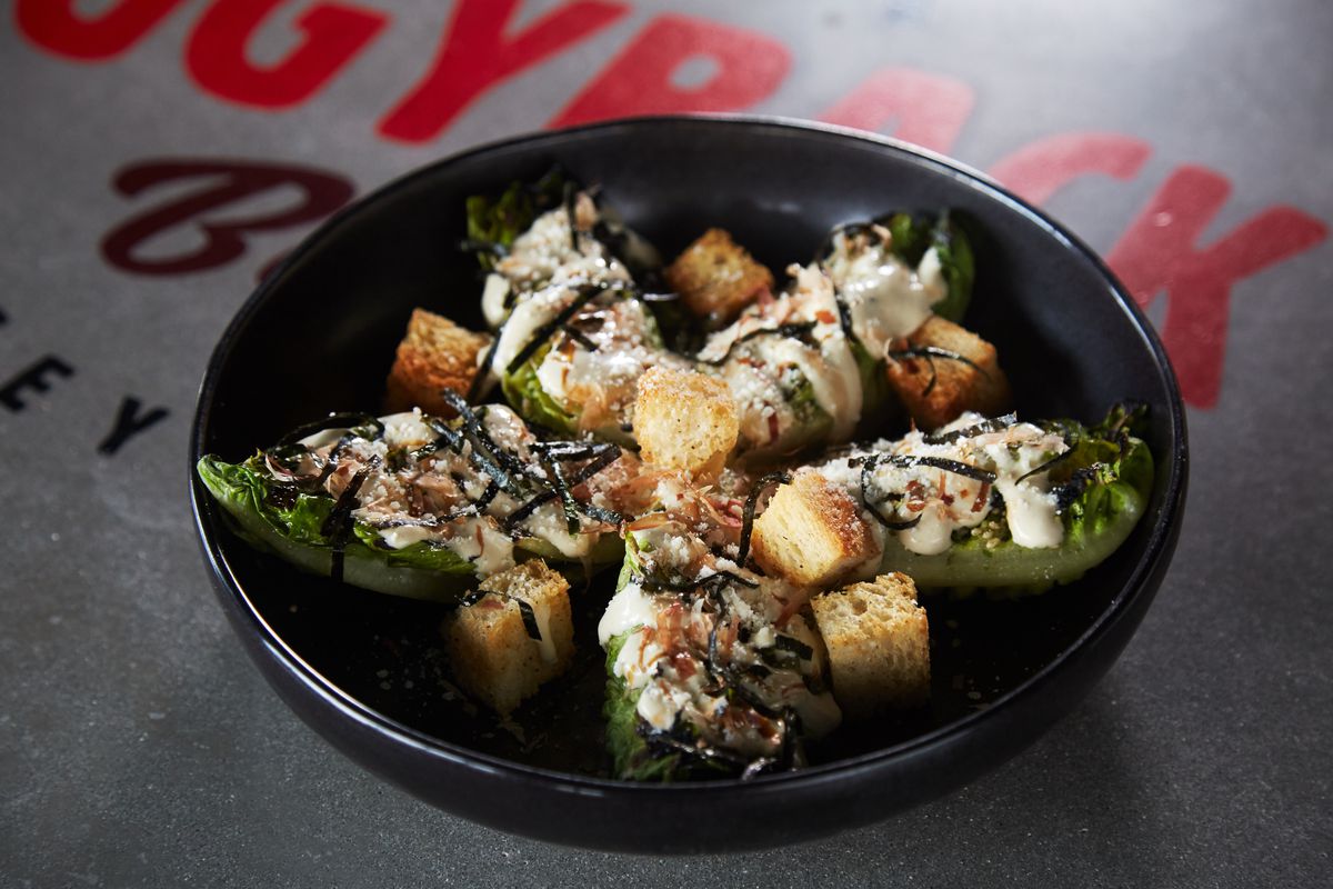 Grilled little gem Caesar salad with bonito, nori, and croutons