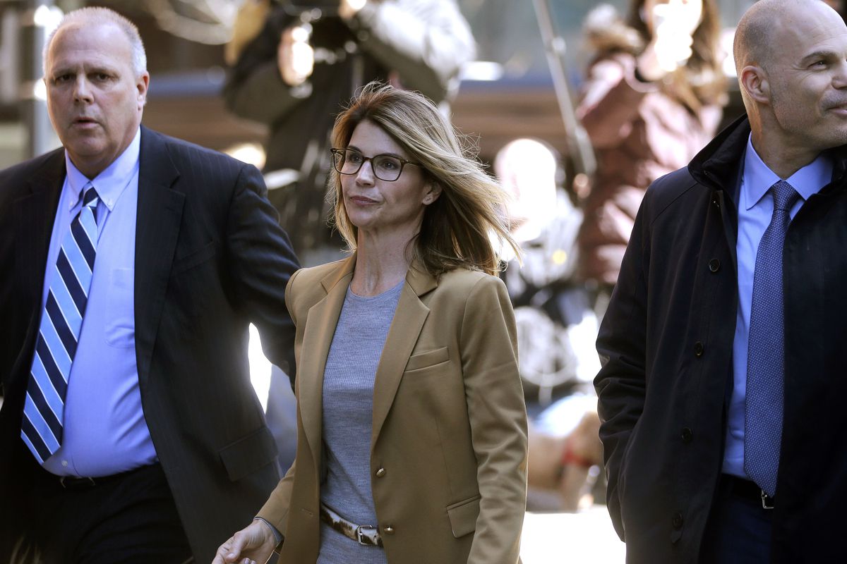 Actress Lori Loughlin arrives at federal court in Boston on Wednesday, April 3, 2019, to face charges in a nationwide college admissions bribery scandal. (AP Photo/Steven Senne)
