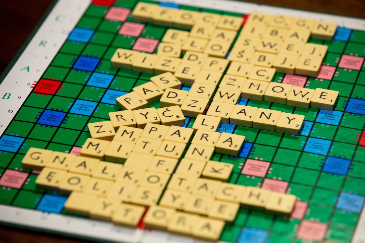 In this photo illustration a close-up of Scrabble board game...