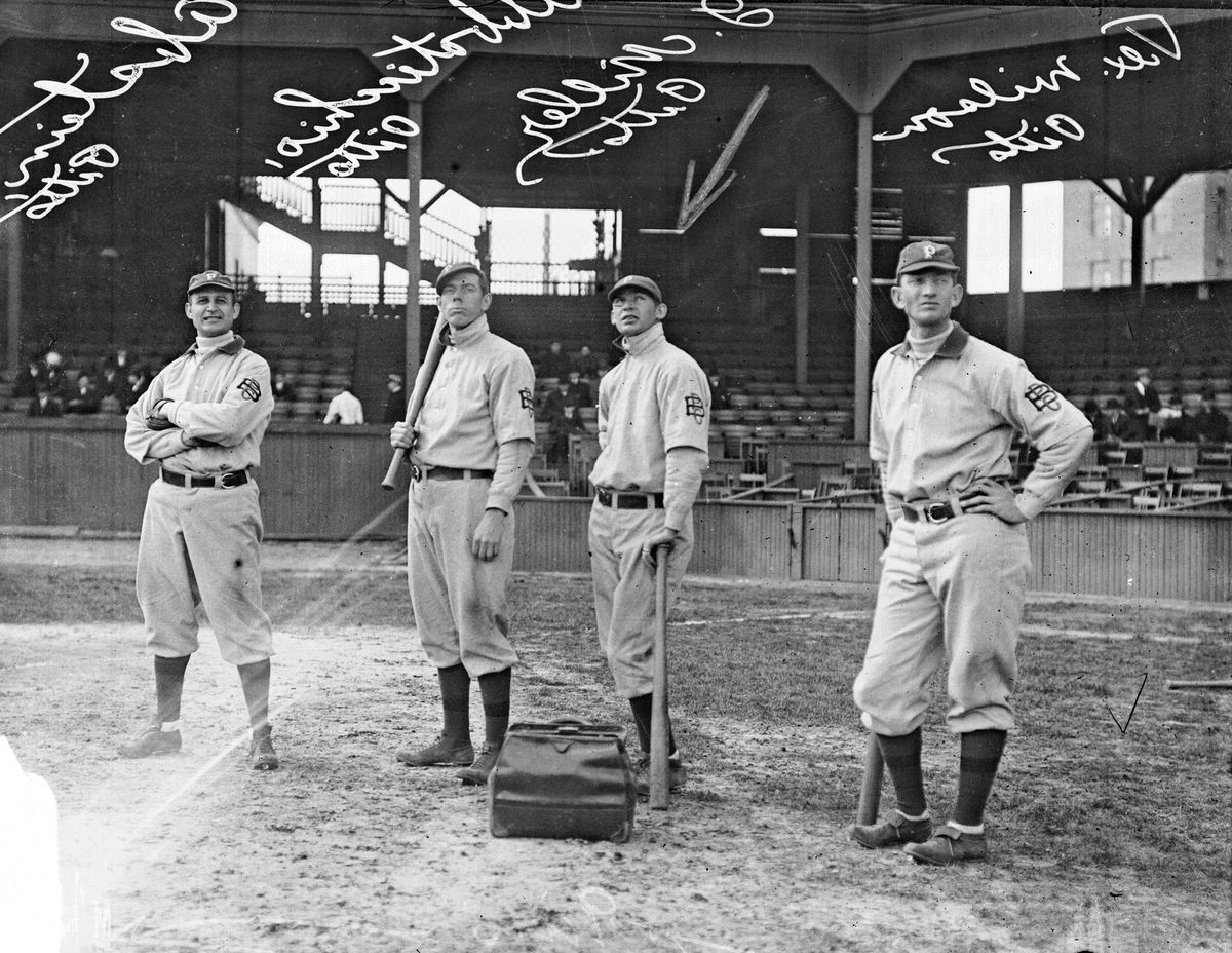 Portrait of American baseball players, from left, Bill Abstein (1883 - 1940), Ed Abbaticchio (1877 - 1957), Dots Miller (1886 - 1923, and Chief Wilson (1883 - 1954), all of the Pittsburgh Pirates, pose on the field at West Side Grounds, Chicago, Illinois, 1909.