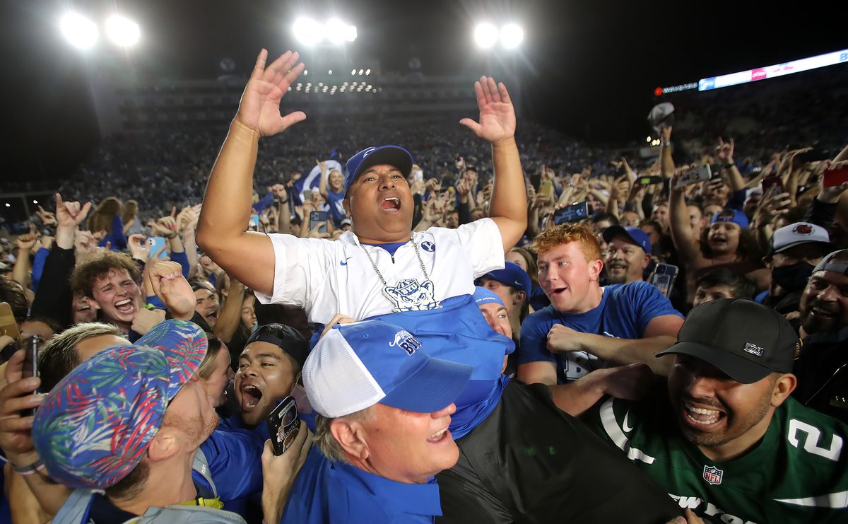 Brigham Young Cougars head coach Kalani Sitake celebrates as he is lifted into the air by fans as BYU defeats Utah in an NCAA football game at LaVell Edwards Stadium in Provo on Saturday, Sept. 11, 2021. BYU won 27-16, ending a nine-game losing streak to the Utes.