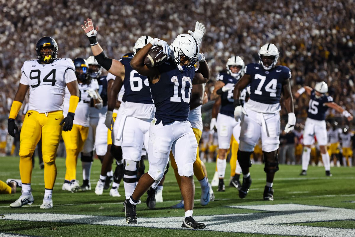 Nicholas Singleton #10 of the Penn State Nittany Lions celebrates after scoring a touchdown against the West Virginia Mountaineers during the first half at Beaver Stadium on September 2, 2023