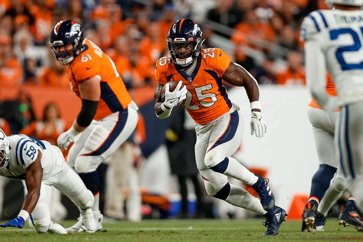 Denver Broncos running back Melvin Gordon III (25) runs the ball in the second quarter against the Indianapolis Colts at Empower Field at Mile High.