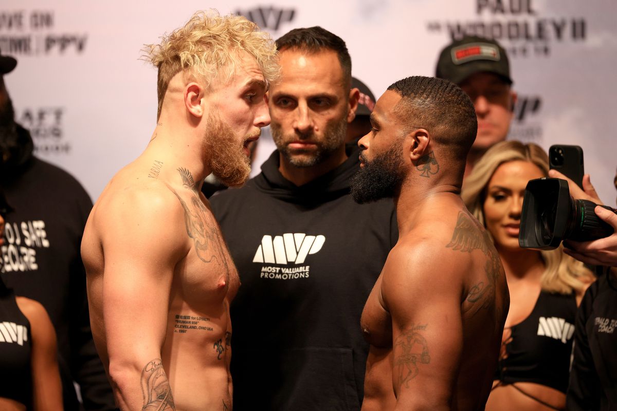 Jake Paul and Tyron Woodley poses during a weigh in at the Hard Rock Hotel and Casino ahead of this weekends fight on December 17, 2021 in Tampa, Florida.