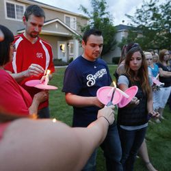 Friends gather during a candlelight vigil in Logan Thursday, July 10, 2014. Ronald Lee Haskell, a recent Logan resident, has been charged with multiple counts of capital murder in a shooting in Texas. Haskell and his family lived in Logan for several years.