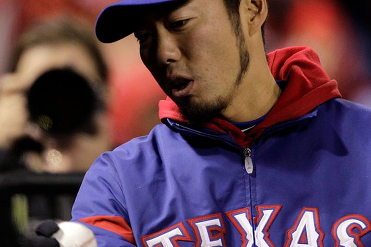 ST LOUIS, MO - OCTOBER 19:  Koji Uehara #19 of the Texas Rangers looks on during Game One of the MLB World Series against the St. Louis Cardinals at Busch Stadium on October 19, 2011 in St Louis, Missouri.  (Photo by Rob Carr/Getty Images)