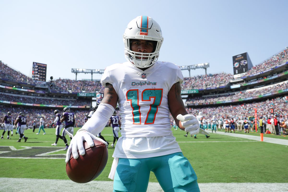 Wide receiver Jaylen Waddle #17 of the Miami Dolphins celebrates after catching a first half touchdown pass against the Baltimore Ravens at M&amp;T Bank Stadium on September 18, 2022 in Baltimore, Maryland.