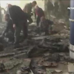 FILE - In this Tuesday, March 22, 2016 image made from video provided by RTL Belgium, people receive treatment in the debris-strewn terminal at Brussels Airport after a series of explosions. Across the globe, terrorist attacks flared at a relentless pace throughout the year. Among the many high-profile attacks were those that targeted airports in Brussels and Istanbul, a park teeming with families and children in Pakistan, and the seafront boulevard in Nice, France, where 86 people were killed when a truck plowed through a Bastille Day celebration. In Iraq alone, many hundreds of civilians were killed in repeated bombings.