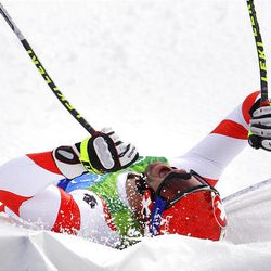 Switzerland's Didier Defago reacts after winning the gold medal in the men's downhill Monday.