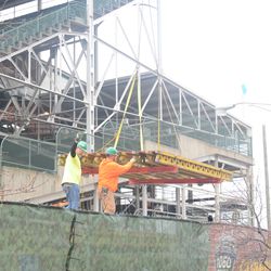 Concrete forms being lifted off the flatbed on Waveland - 