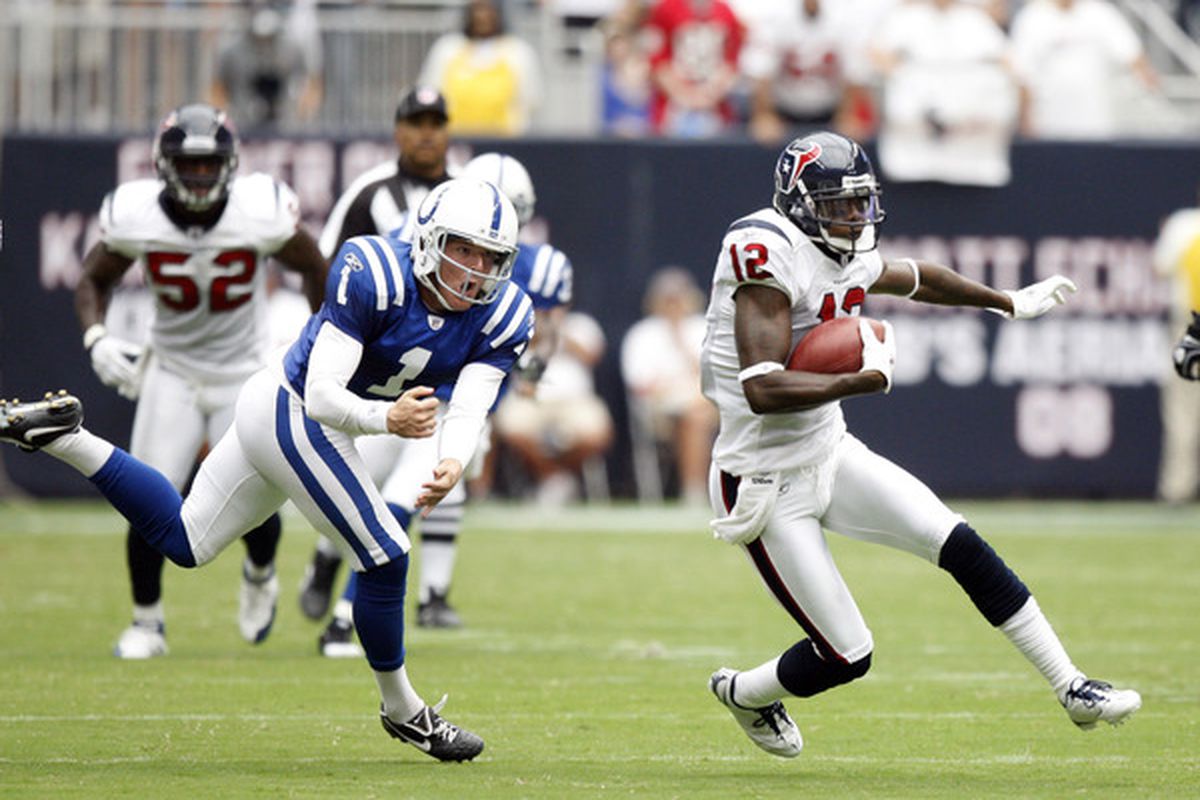 HOUSTON - SEPTEMBER 12:  Jacoby Jones #12 of the Houston Texans avoids kicker Pat McAfee #1 of the Indianapolis Colts on the opening kick return at Reliant Stadium on September 12 2010 in Houston Texas.  (Photo by Bob Levey/Getty Images)