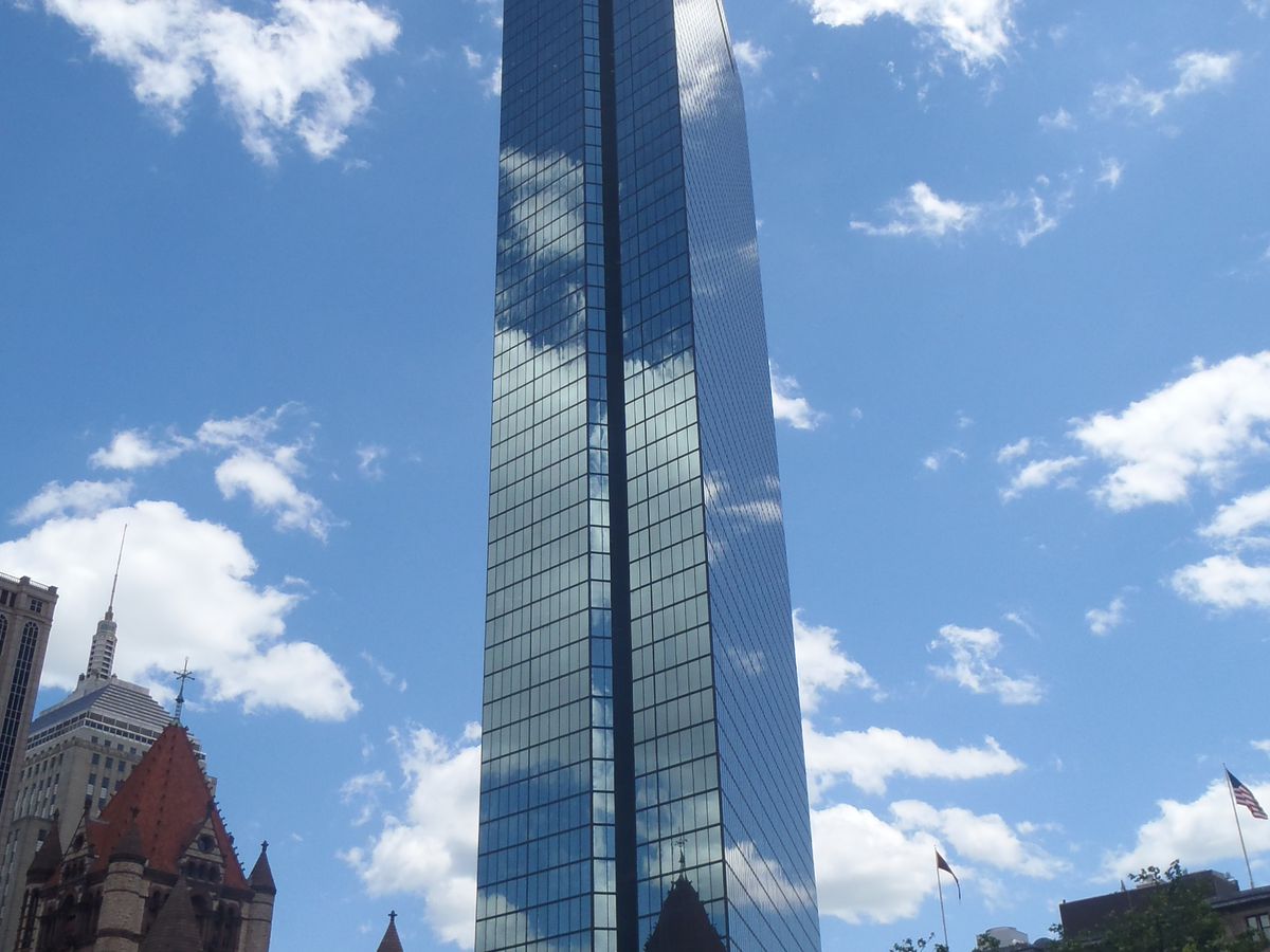 A tall skyscraper with many windows.