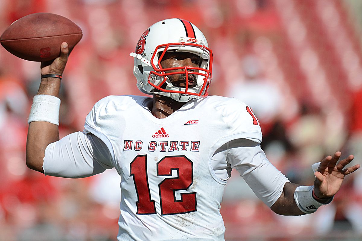 North Carolina State Wolfpack quarterback Jacoby Brissett (12) throws a touchdown pass first half against the South Florida Bulls at Raymond James Stadium