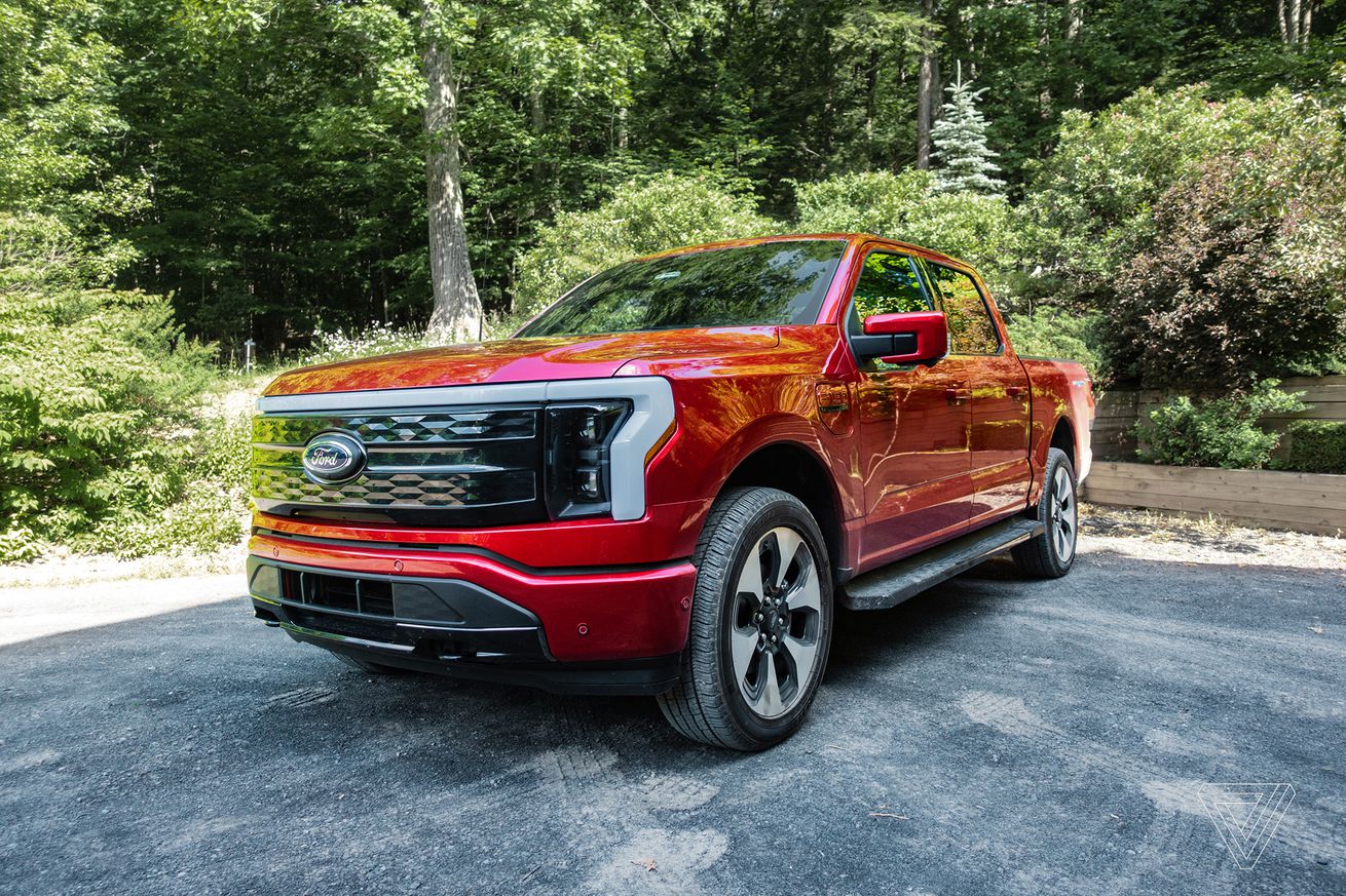 The Ford F-150 Lightning in a driveway
