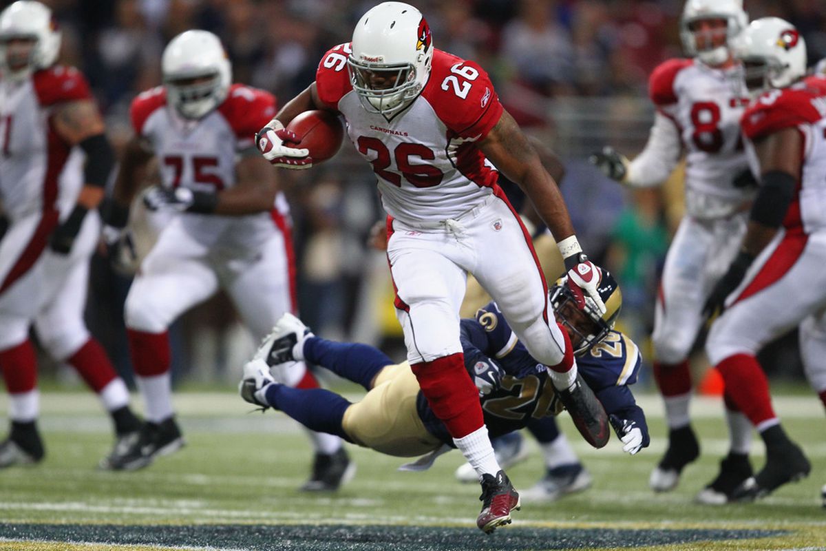 Beanie Wells #26 of the Arizona Cardinals breaks free for a 53-yard run against  Darian Stewart #20 of the St. Louis Rams.  (Photo by Dilip Vishwanat/Getty Images)