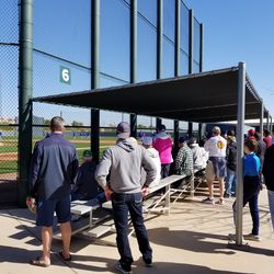 A fairly large crowd watching practice