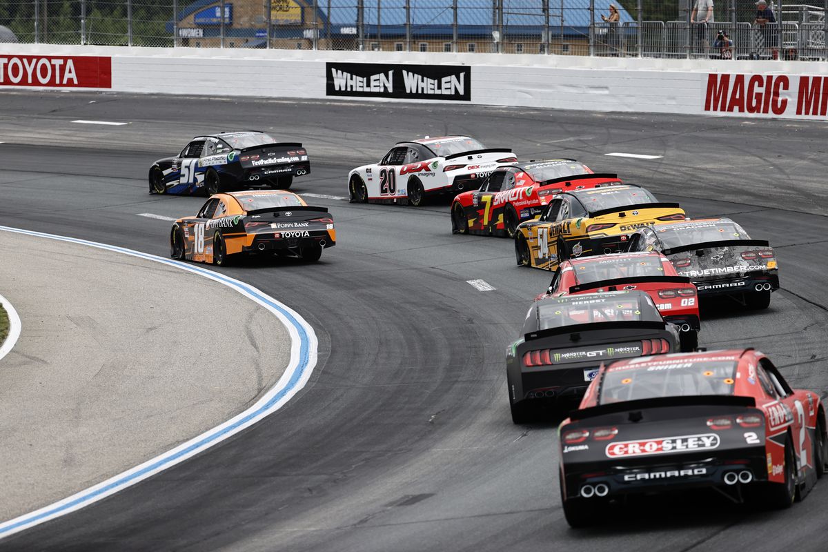 Cars hit turn 2 during the Xfinity Series - Ambetter Get Vaccinated 200 on July 17, 2021 at New Hampshire Motor Speedway in Loudon, New Hampshire.