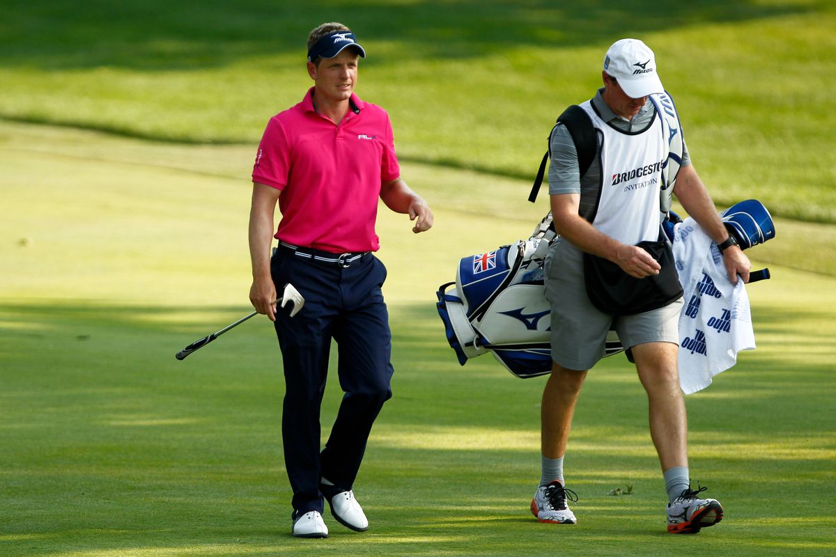 Aug. 3, 2012; Akron, OH, USA; Luke Donald (left) and his caddie approach the 18th green during the second round of the WGC-Bridgestone Invitational at Firestone Country Club-South Course.  Mandatory Credit: Debby Wong-US PRESSWIRE