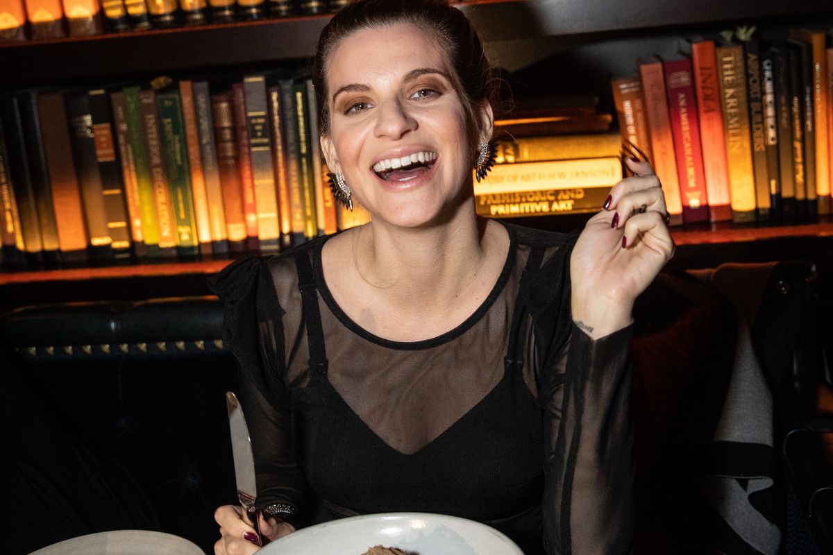 A model dines at a restaurant