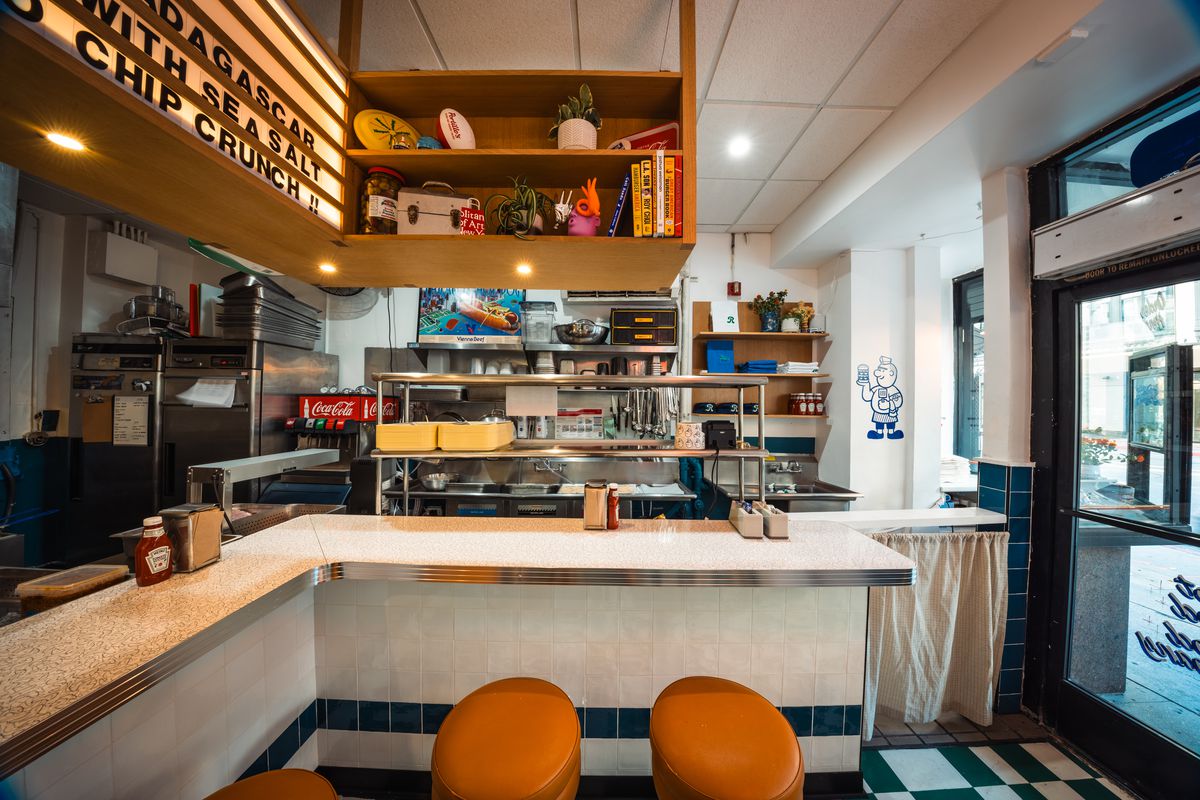 Counter seating and food preparation area at Rita’s Deluxe restaurant in Downtown Los Angeles.